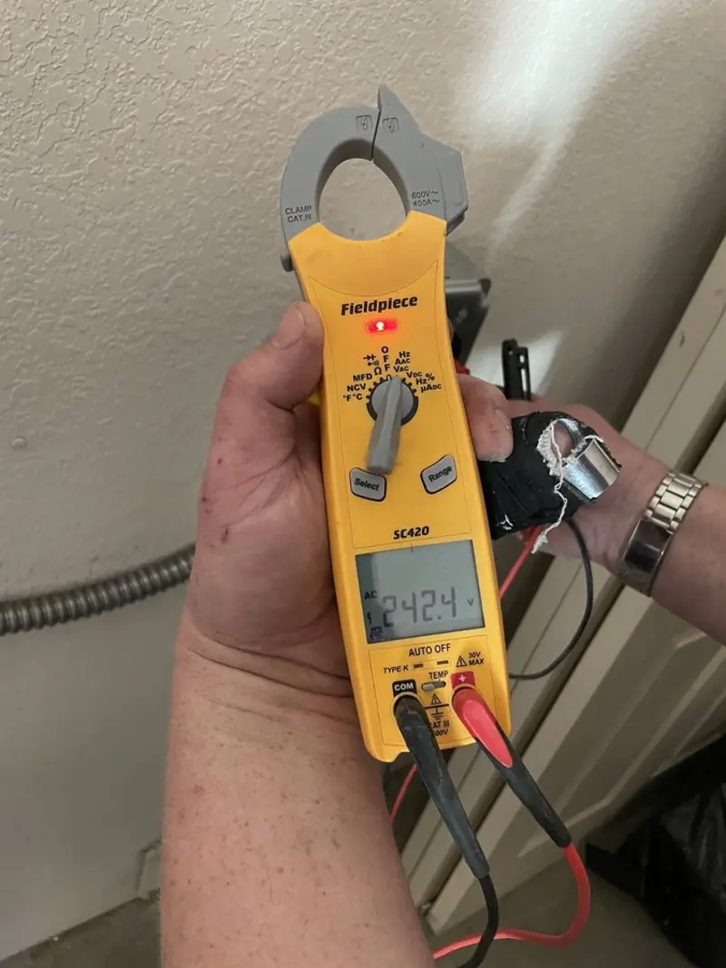 Voltage testing with clamp meter during Electrical Installation Services in North Shore